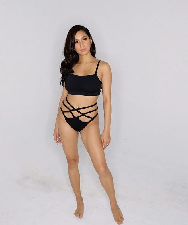 Roxanne Barcelo poses in her black two-piece. 